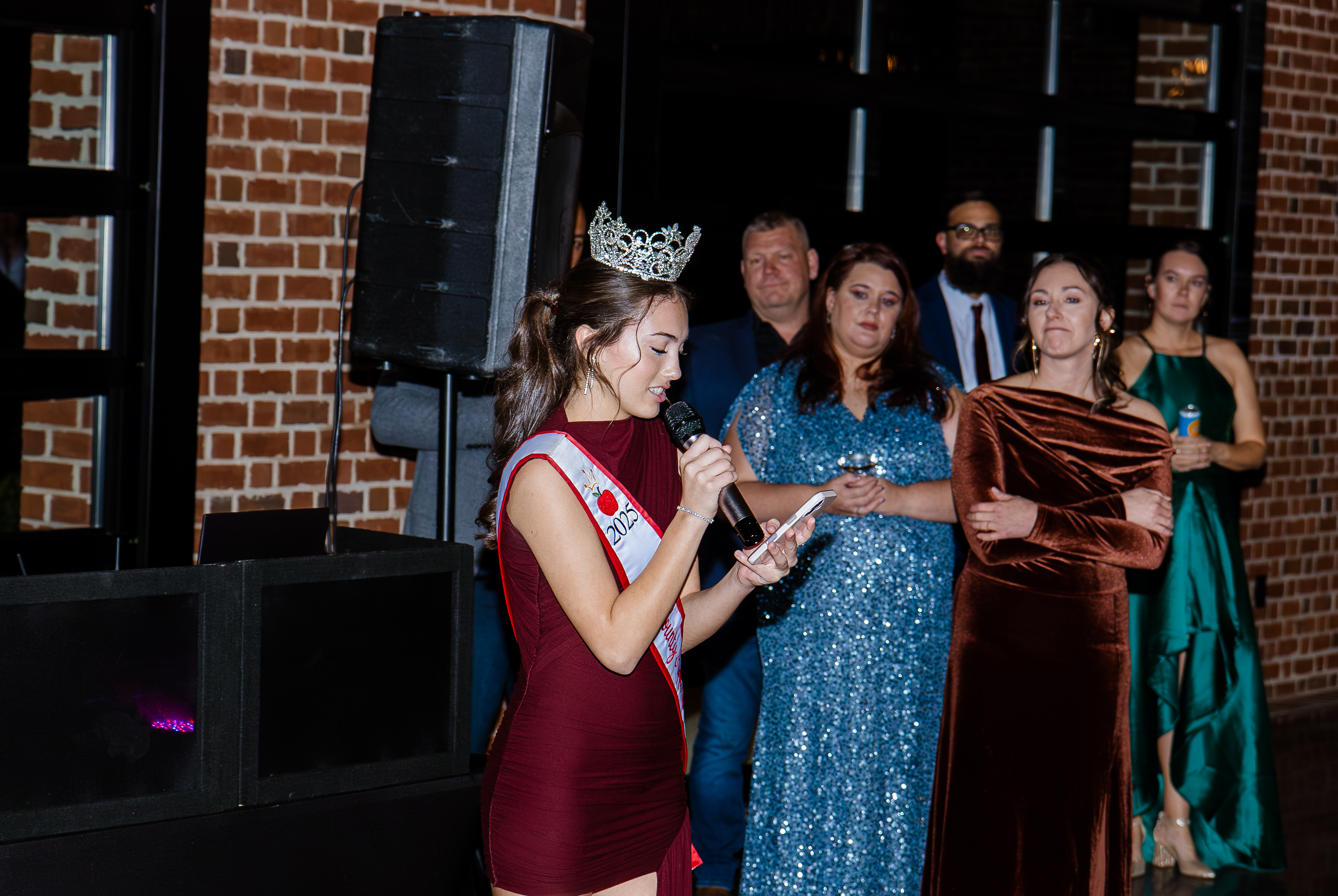 Apple Queen Jocelyn speaking at Christmas Gala 2025